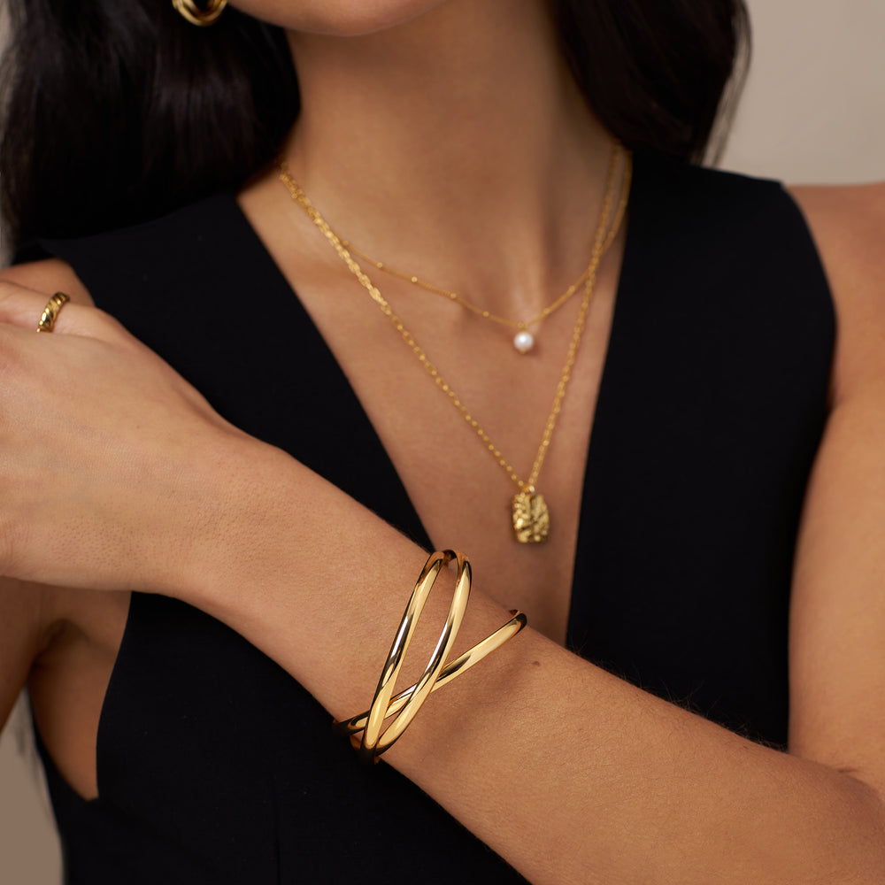 gold_interlocking_bangle_bracelets