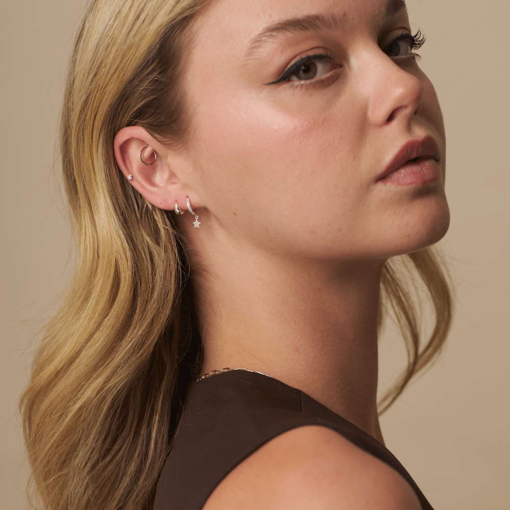 Model Wearing Earrings Pavé Mini Micro Star Drop Hoops Silver