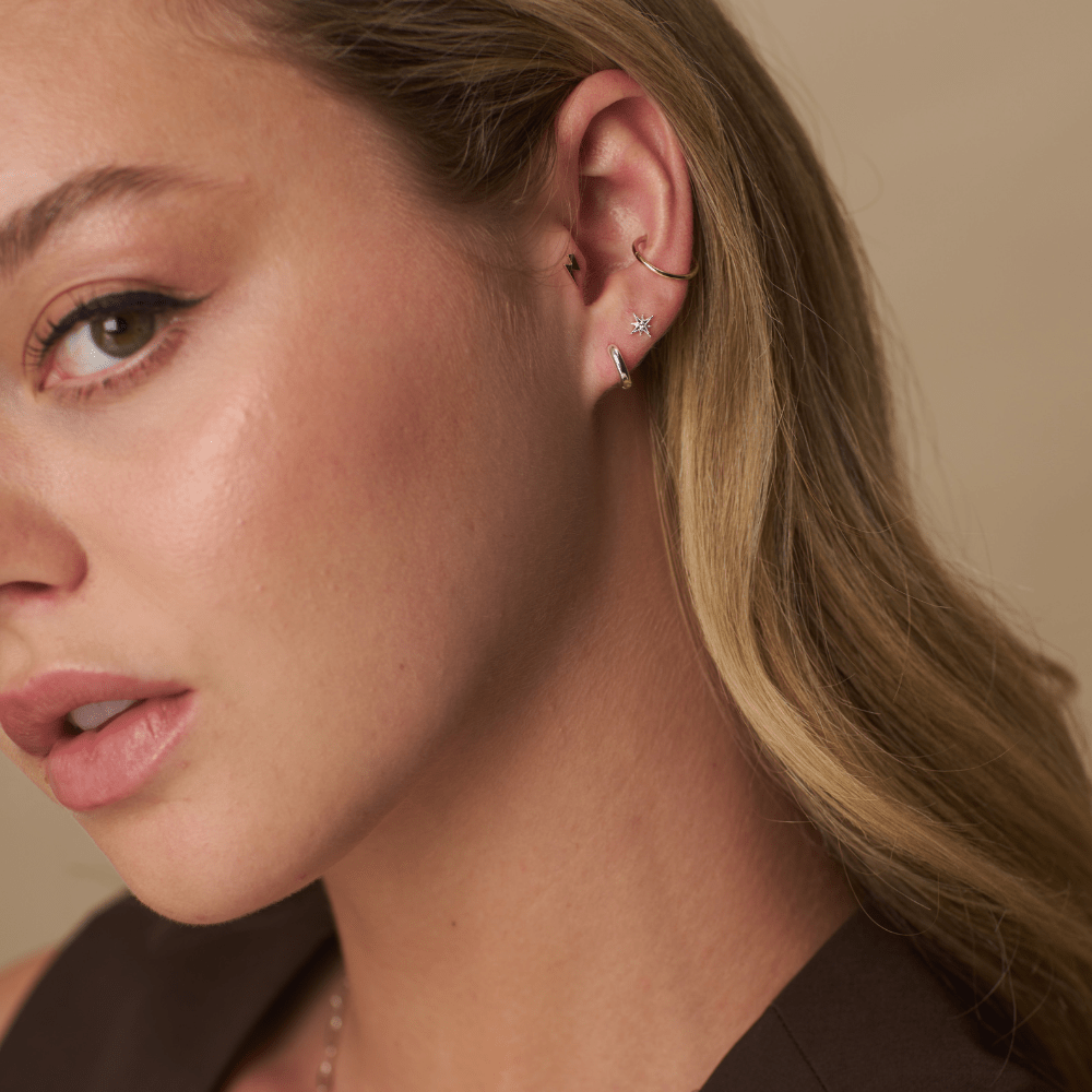 Model Wearing Earrings Starburst & Micro Hoop Pack Silver
